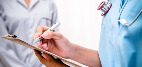 doctor prescribes treatment for lower back pain